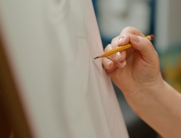 female-artist-holding-pencil-draw-vase-outline-sketch-canvas-drawing-professional-artwork-masterpiece-creation-using-artistic-tools-equipment-hobby-handheld-shot-close-up